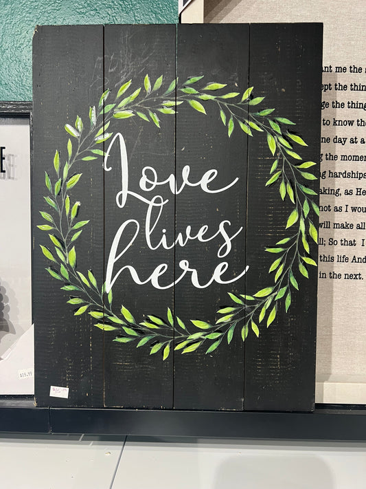 “Love lives here” wall decor