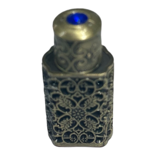 Tiny bronze jeweled healing oil